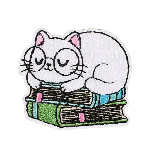 Cat on Books Iron-On Patch (5.5 × 5.3 cm) – Embroidered Patch for Denim, Jackets & Tote Bags